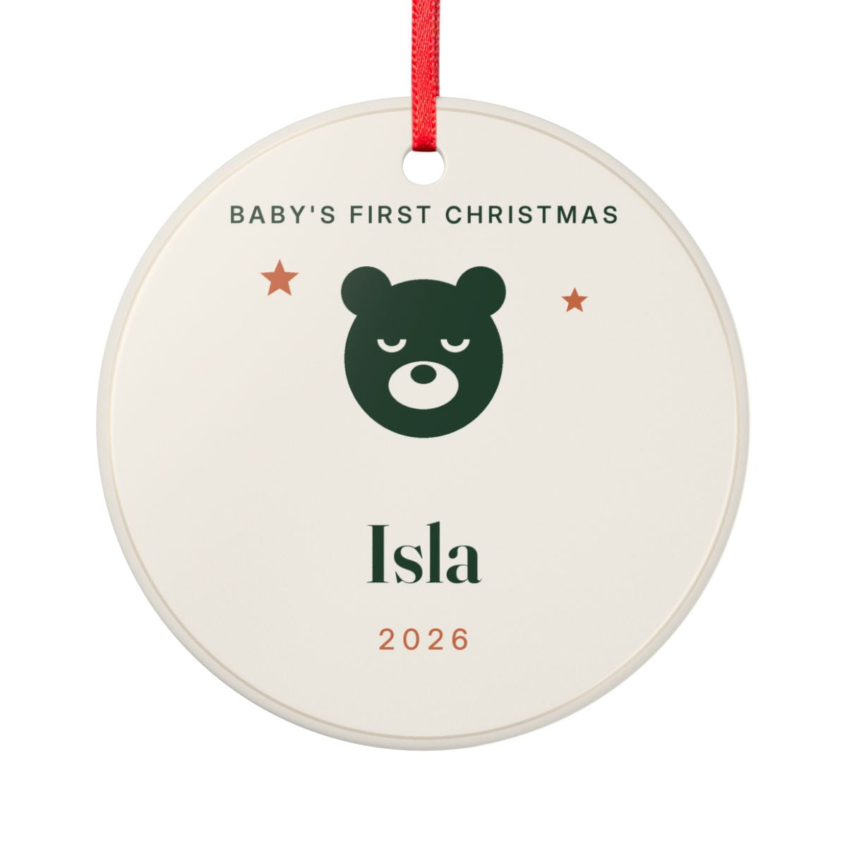 Round Baby's First Christmas ceramic ornament on a red ribbon with a sleeping bear, the name Isla and the year 2026