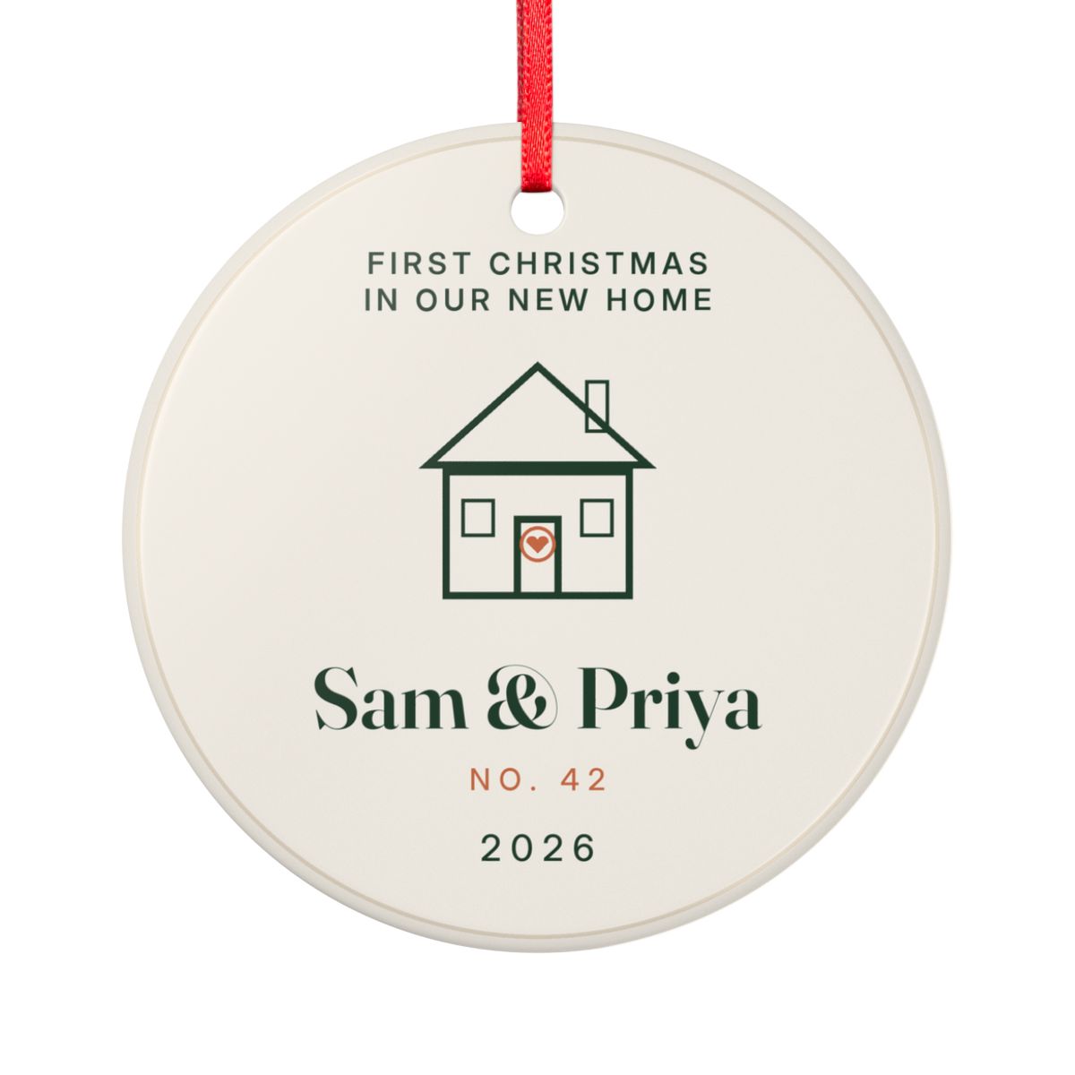 First Christmas in our new home ornament mock-up seen from the other side, with the same line-drawn house, 'Sam & Priya', 'No. 42' and '2026'