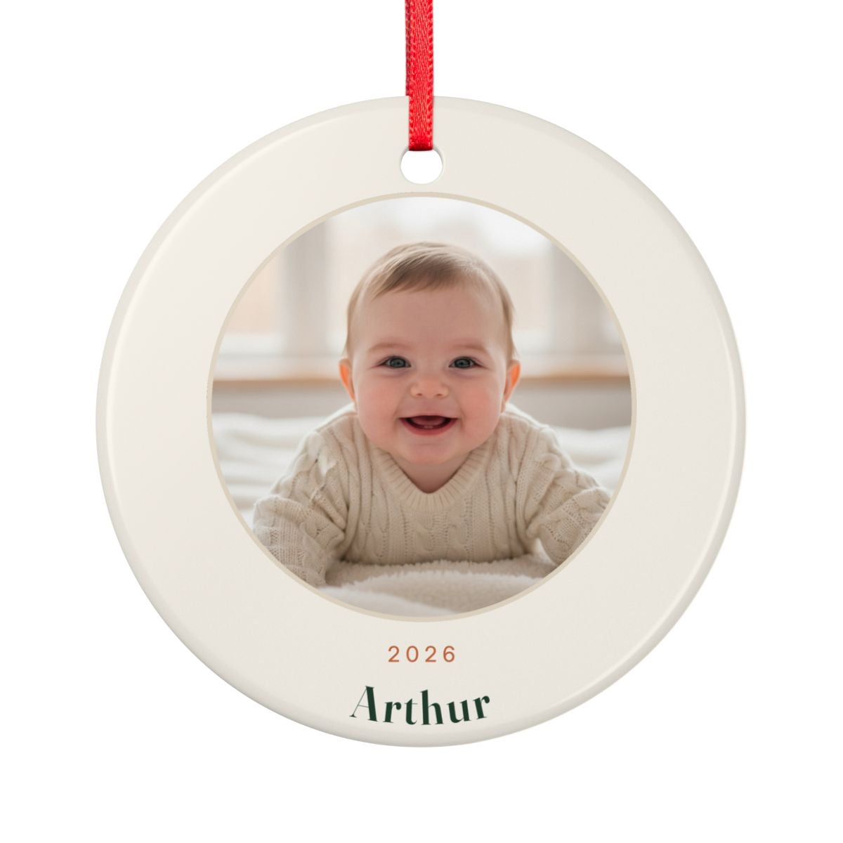 Baby's First Christmas photo ornament mock-up seen from the other side, with the same sample baby photo, '2026' and 'Arthur'