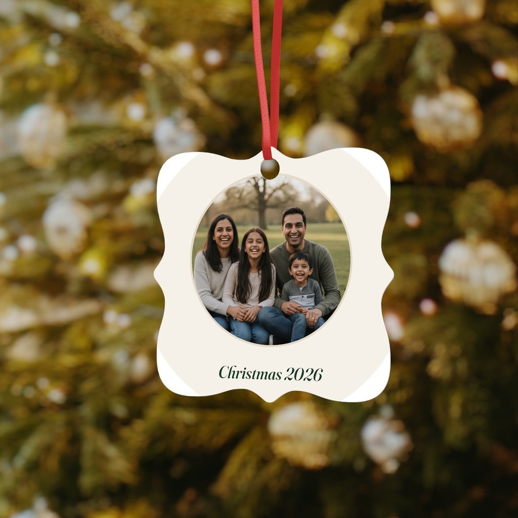Photo aluminium ornament mock-up hanging on a red ribbon in front of a decorated Christmas tree, family photo in a circle