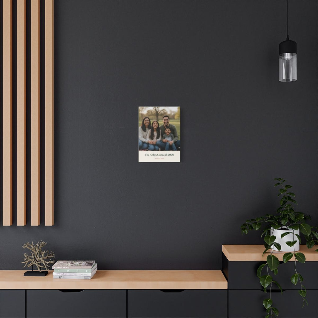 Personalised family photo canvas mock-up hung on a dark grey wall above a sideboard with plants and wooden slats