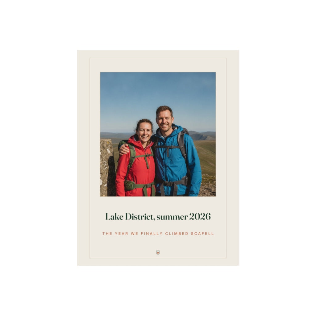 Personalised photo print with caption mock-up, two hikers on a fell above 'Lake District, summer 2026' in a printed cream border