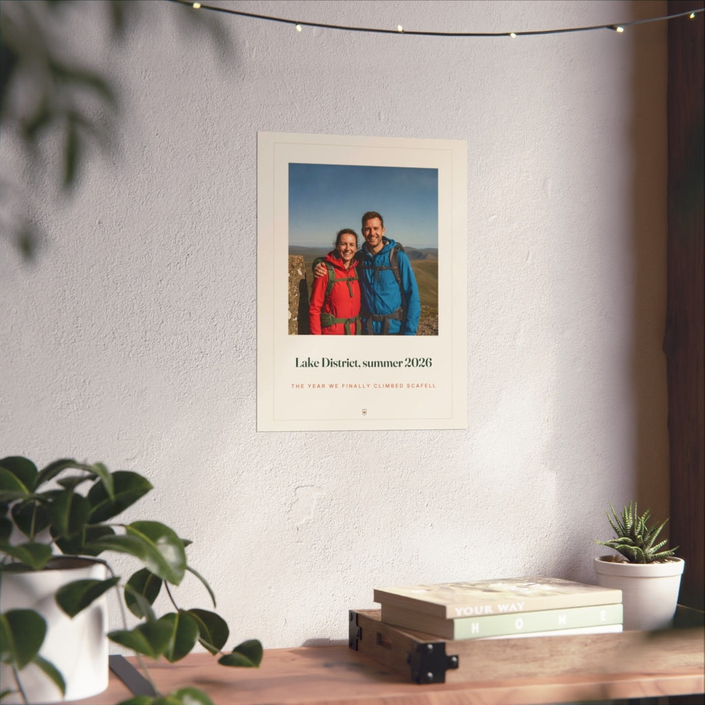 Photo print with caption mock-up in the larger size on a sunlit white wall above a wooden shelf with books and plants