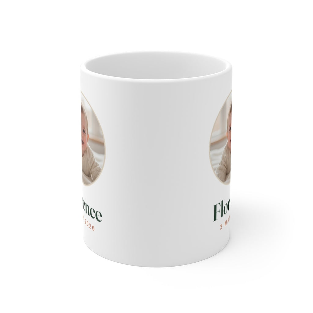 Baby photo mug seen from the front with the handle behind, showing the design printed on both sides