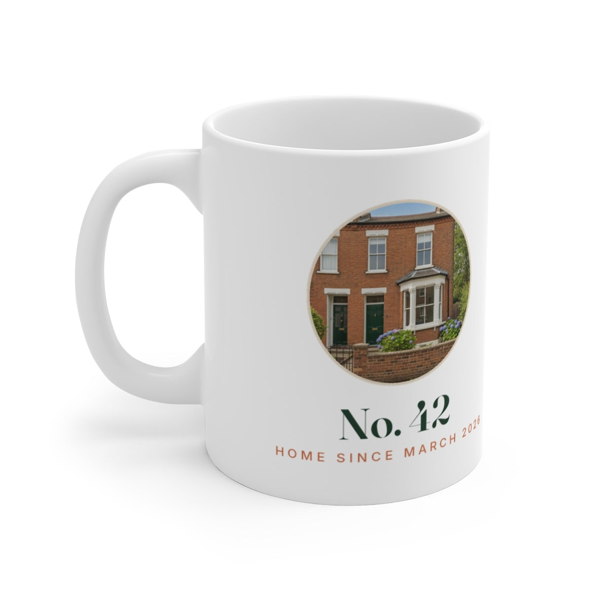 Personalised new home photo mug mock-up with a red-brick house in a round photo, 'No. 42' and 'Home since March 2026'