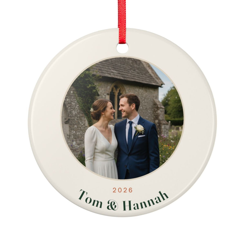 Couple photo ceramic Christmas ornament mock-up seen from the other side, with the same sample wedding photo, '2026' and 'Tom & Hannah'