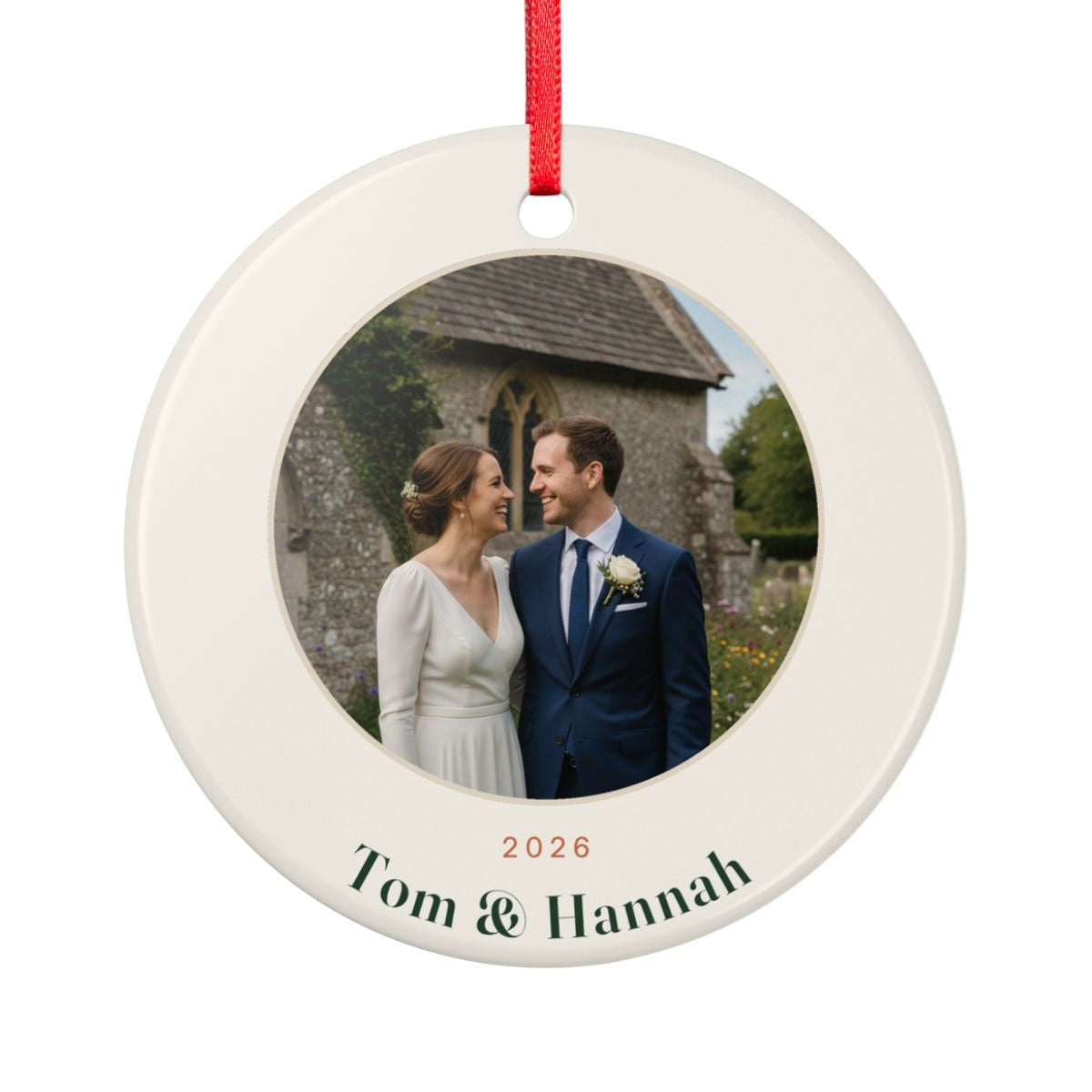 Couple photo ceramic Christmas ornament mock-up seen from the other side, with the same sample wedding photo, '2026' and 'Tom & Hannah'