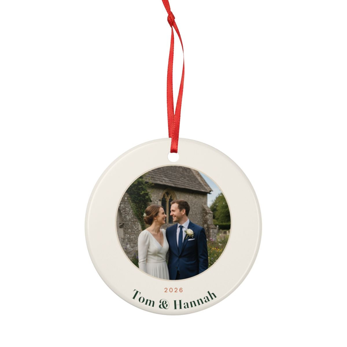 Personalised couple photo Christmas ornament mock-up hanging from a full-length red ribbon, showing the whole ornament