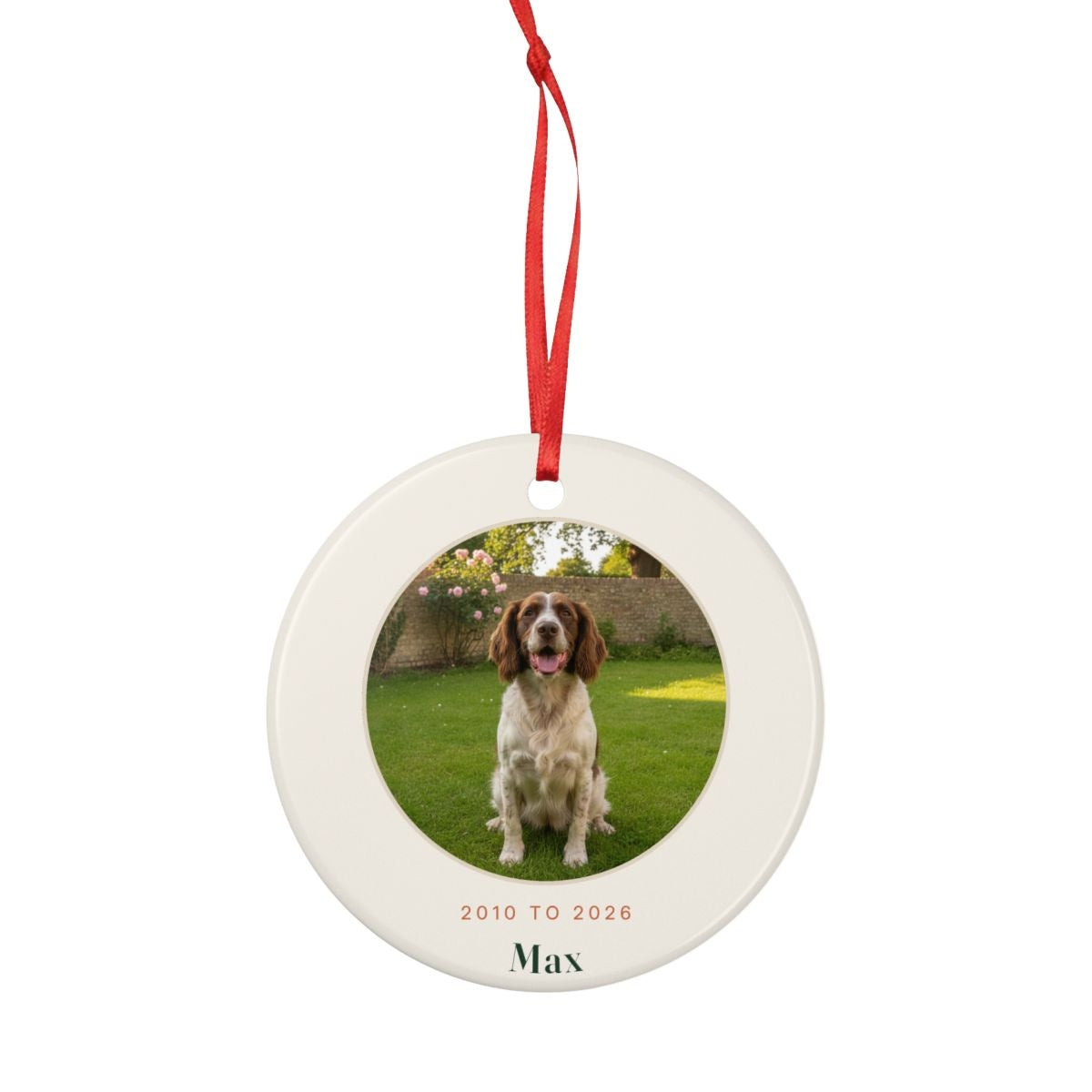 Pet memorial photo ceramic ornament mock-up shown smaller with its full red hanging ribbon tied in a loop above