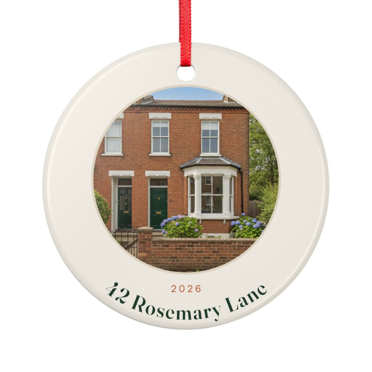 New home photo ceramic ornament mock-up seen from the other side, with the same sample brick house photo, '2026' and '42 Rosemary Lane'