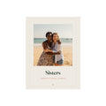 Sisters photo print mock-up with a sample picture, two women hugging on a beach, 'Sisters' and 'Hannah & Grace, always'