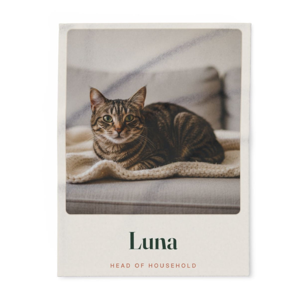 Personalised cat photo fleece blanket mock-up laid flat, with a tabby cat's photo, 'Luna' and 'Head of household'