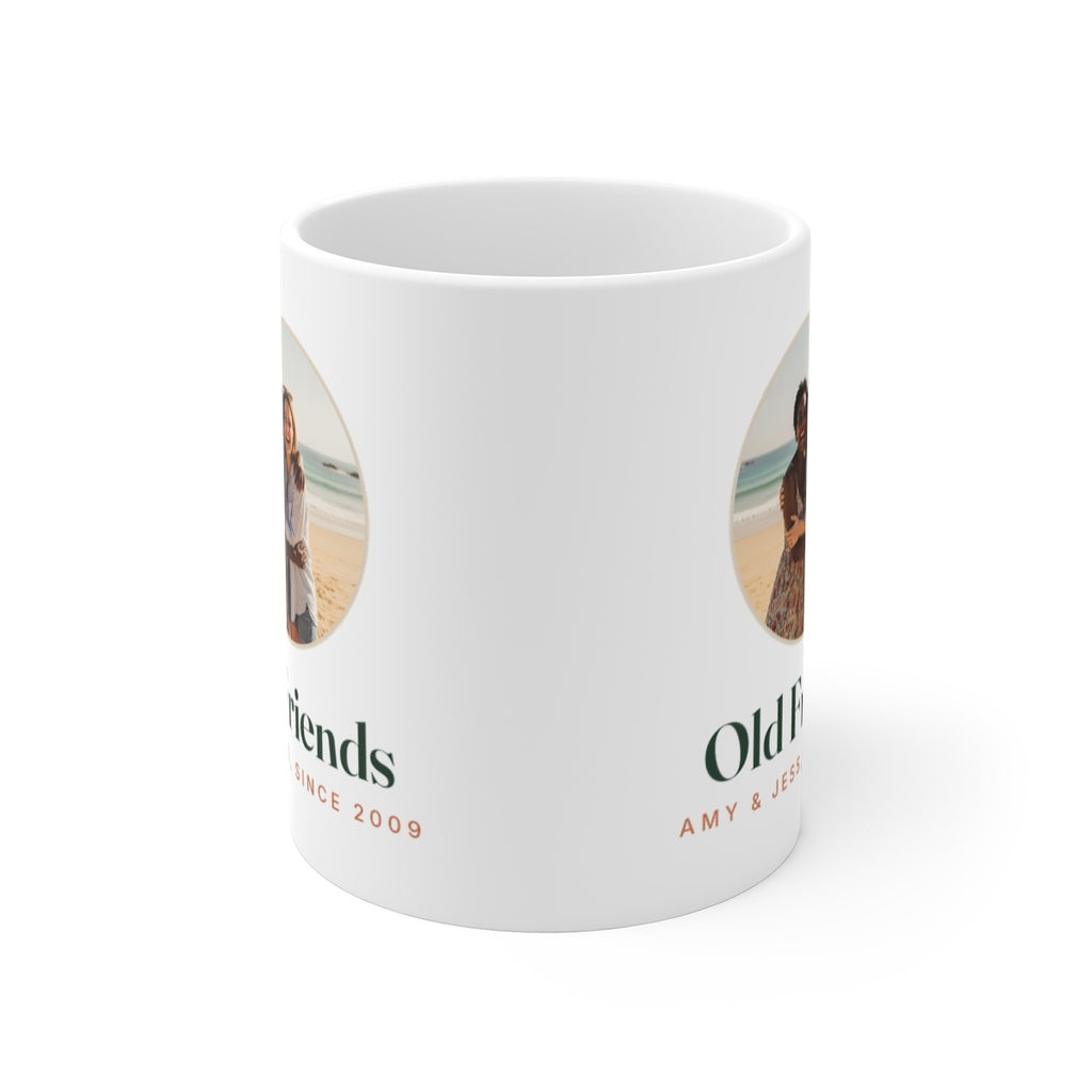 Photo mug for friends mock-up seen from the front with the handle hidden, the photo and 'Old Friends' on both sides