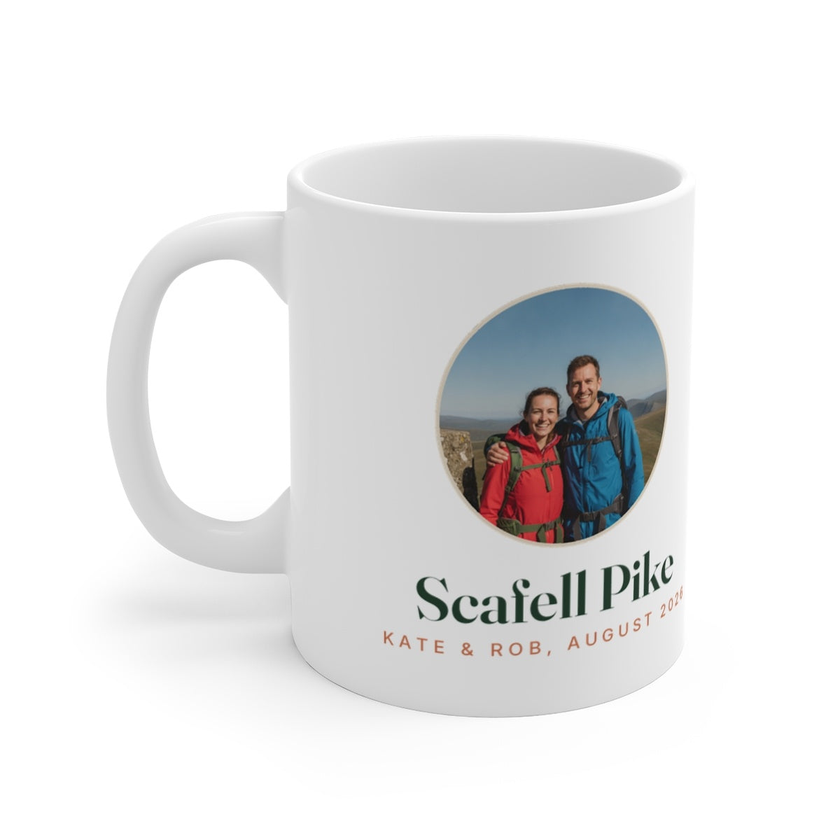Personalised walking photo mug mock-up with a round sample summit photo, 'Scafell Pike' and 'Kate & Rob, August 2026'