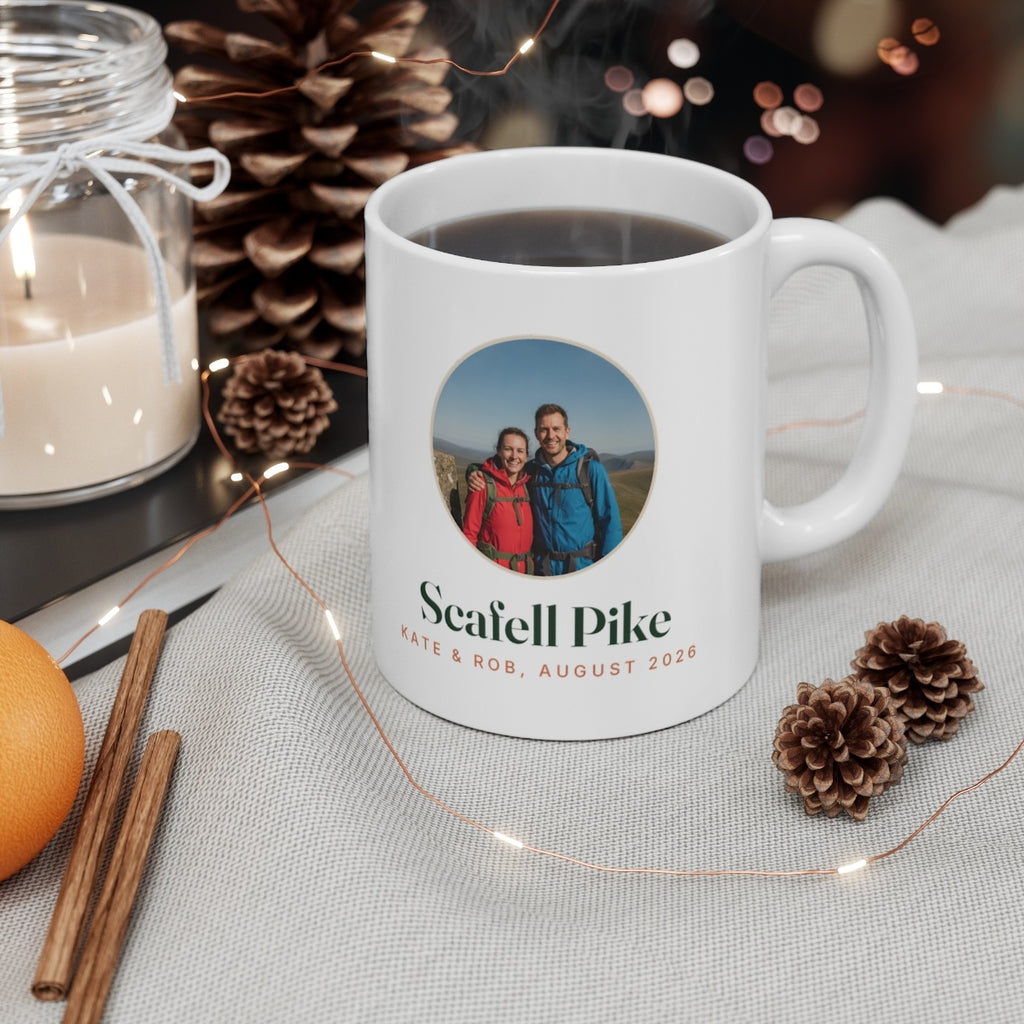 Personalised walking photo mug mock-up filled with coffee on a table with pine cones, a candle and fairy lights