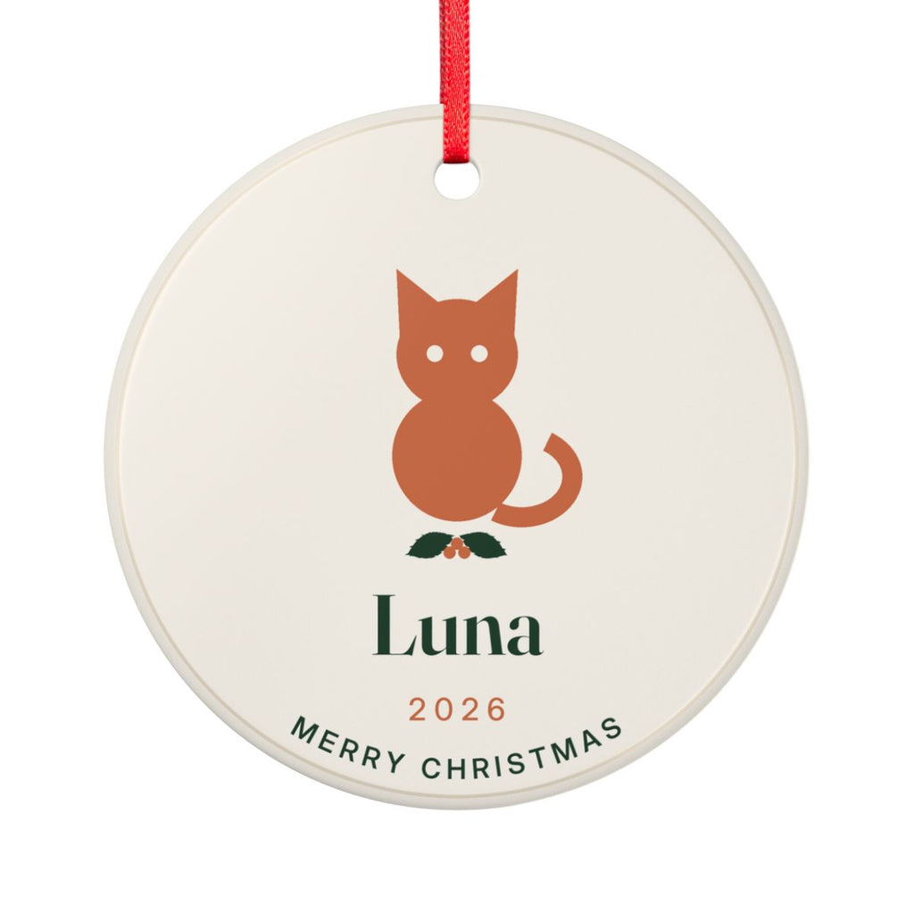 Cat ceramic Christmas ornament mock-up seen from the other side, with the same orange cat on holly, 'Luna', '2026' and 'Merry Christmas'