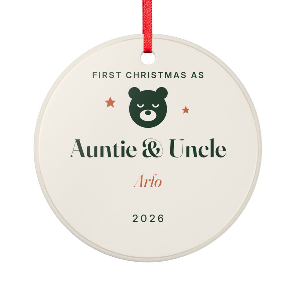 New Auntie and Uncle ornament mock-up seen from the other side, with the same bear face, 'First Christmas as Auntie & Uncle', 'Arlo' and '2026'