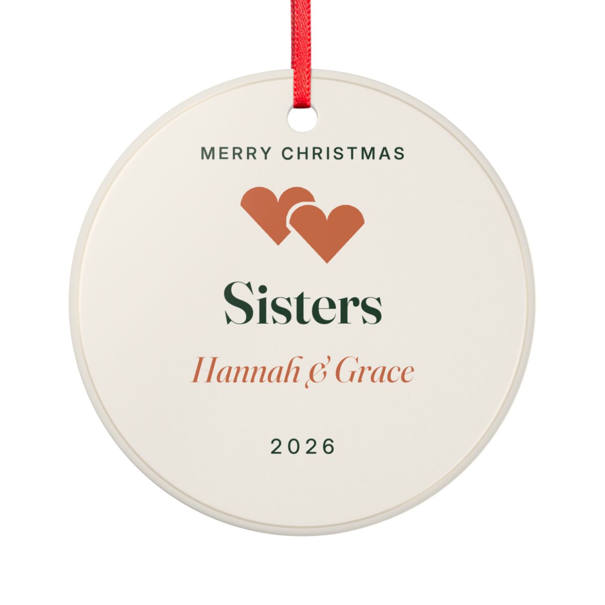Sisters ceramic Christmas ornament mock-up seen from the other side, with the same two orange hearts, 'Sisters', 'Hannah & Grace' and '2026'