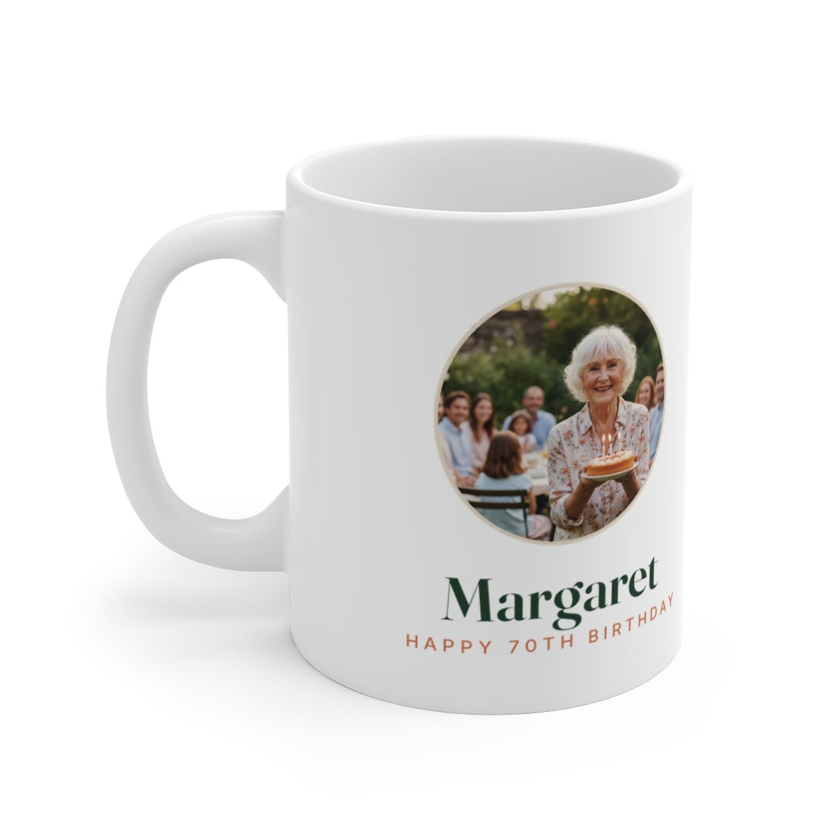 Personalised birthday photo mug mock-up, handle on the left, with a round sample photo, 'Margaret' and 'Happy 70th Birthday'