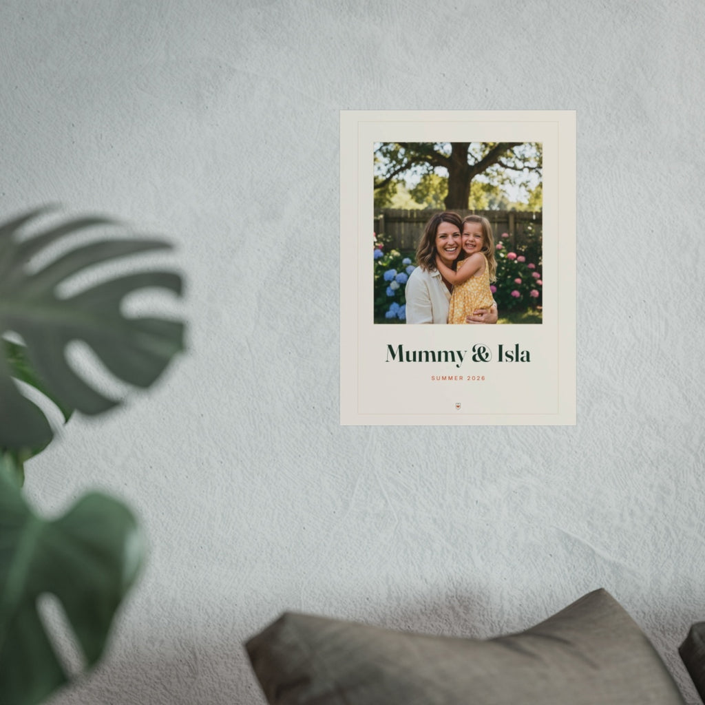 Personalised Mum photo print mock-up on a pale textured wall above grey sofa cushions, with a monstera leaf in front