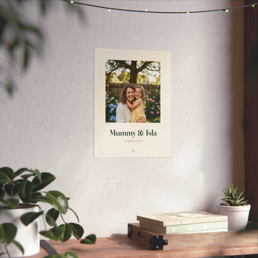 Personalised Mum photo print mock-up on a white wall above a wooden desk with books, plants and a string of lights