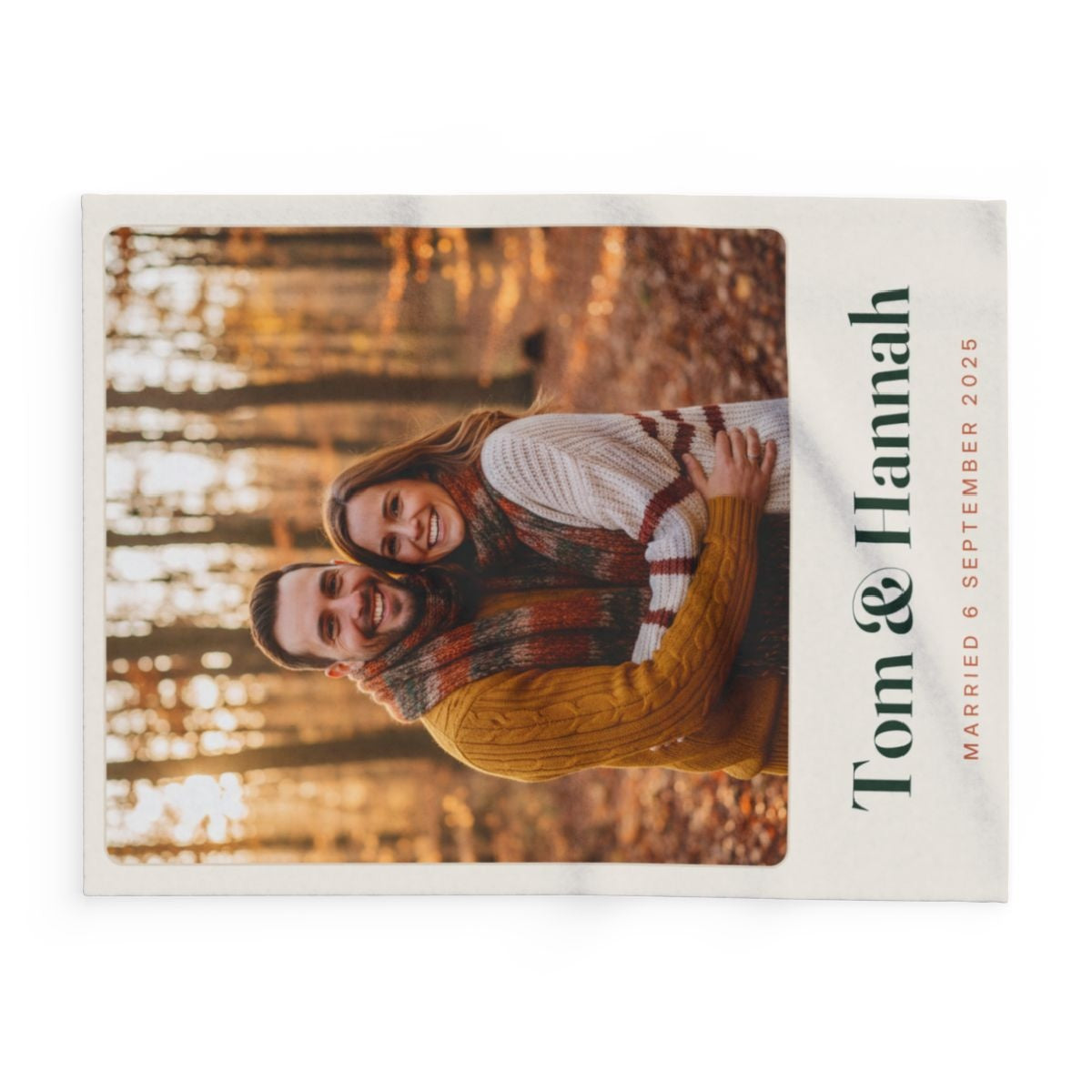 Personalised couple photo fleece blanket mock-up laid flat sideways, with 'Tom & Hannah' running along the right edge