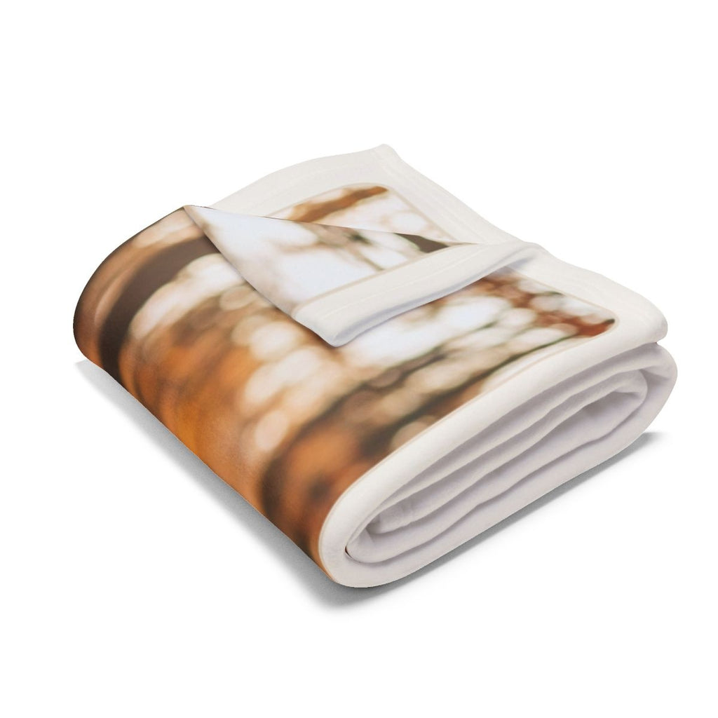 Personalised couple photo fleece blanket mock-up folded, showing the blurred autumn photo and its white border