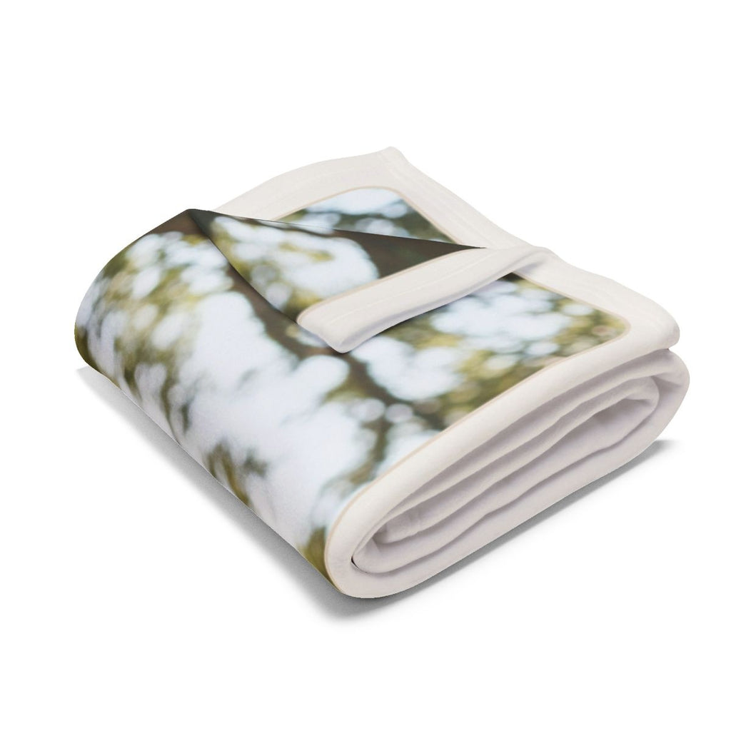 Personalised Mum photo fleece blanket mock-up folded, showing the white border and part of the tree from the sample photo