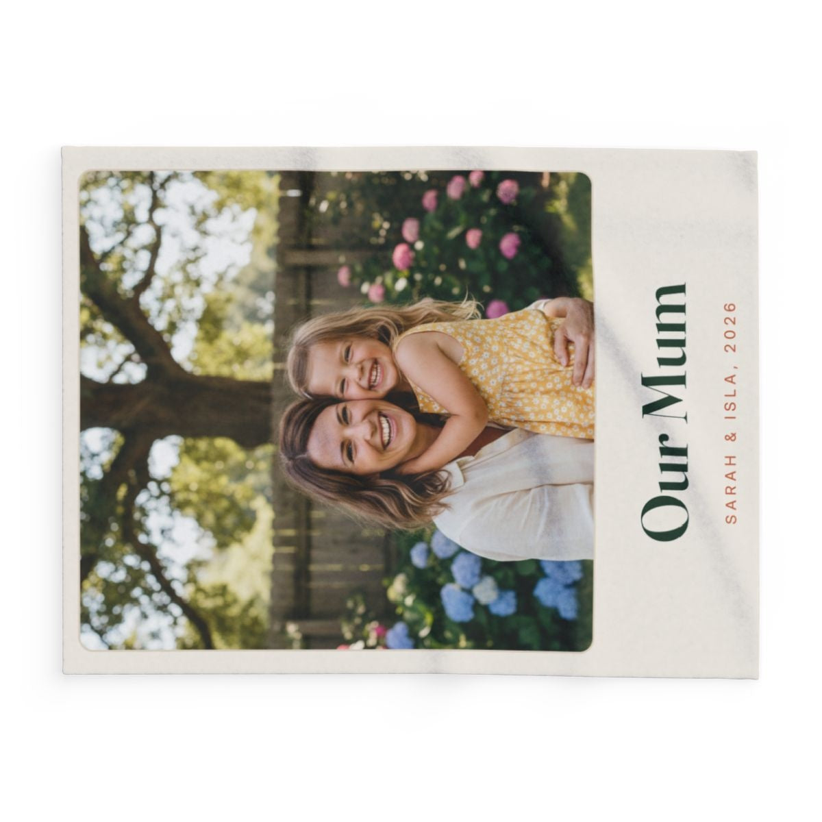 Personalised Mum photo fleece blanket mock-up laid flat sideways, the sample photo and 'Our Mum' caption turned on their side