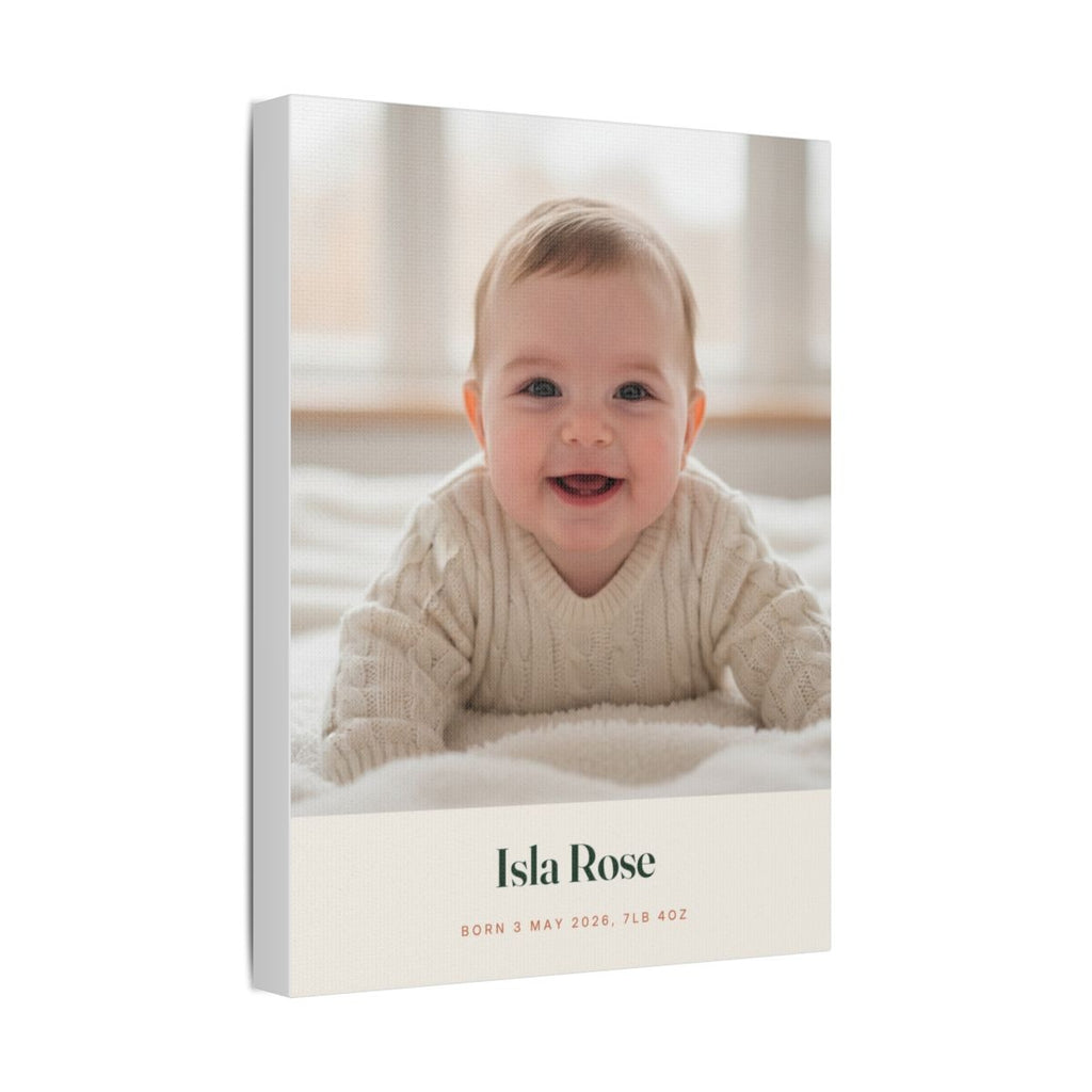 Personalised new baby photo canvas mock-up angled to show the wrapped canvas edge, sample name 'Isla Rose' beneath the photo