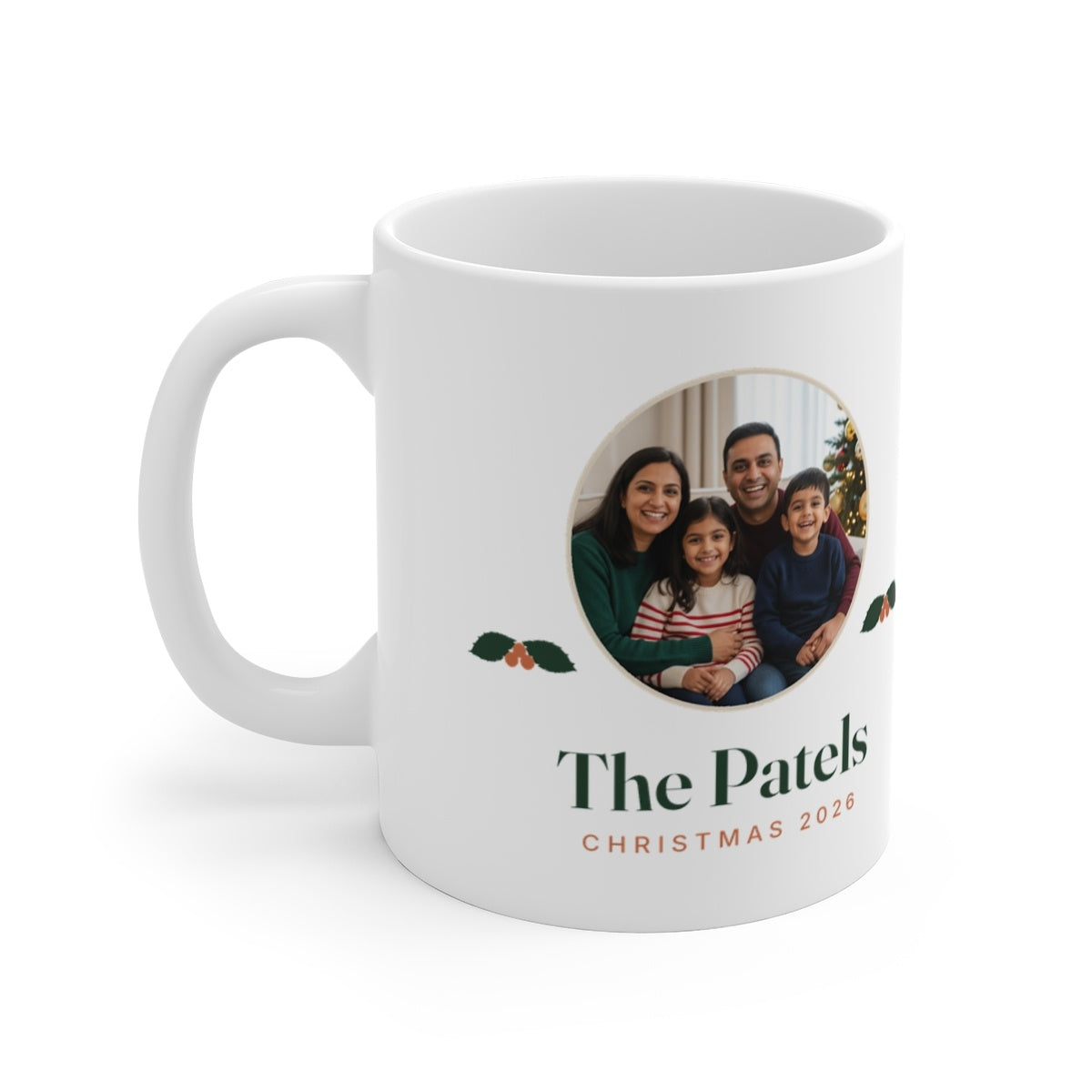 Personalised Christmas photo white mug mock-up, handle on the left, with a round family photo, holly and 'The Patels'