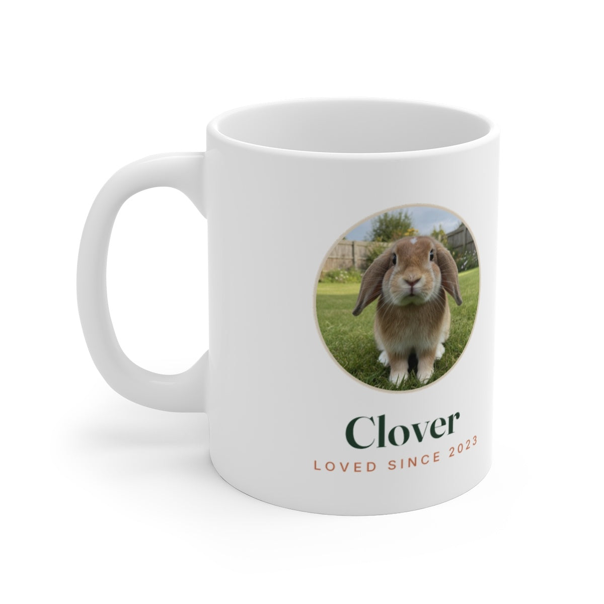 Personalised rabbit photo mug mock-up, sample lop-eared rabbit in a round frame with 'Clover' and 'Loved since 2023'