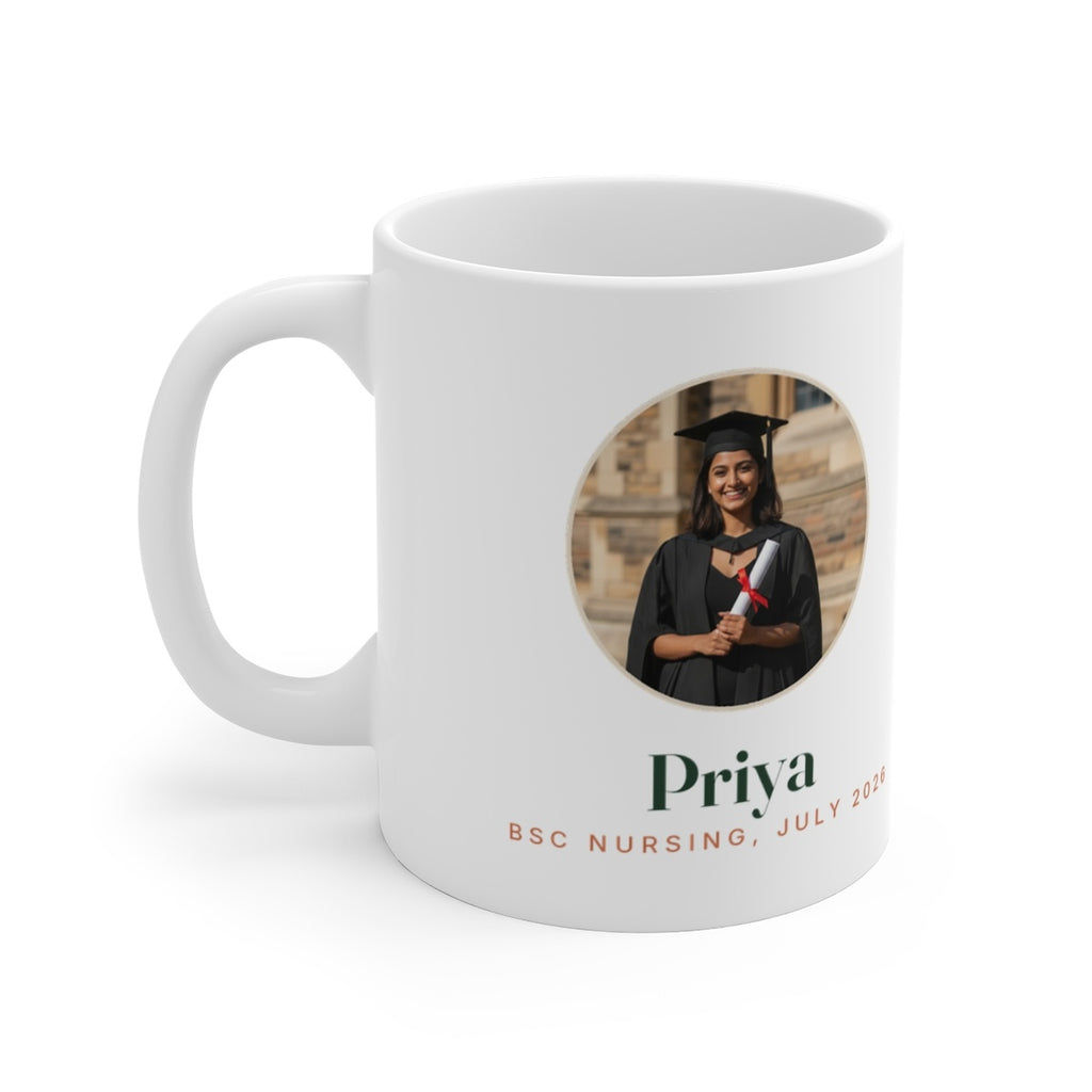 Personalised graduation photo mug mock-up, handle on the left, with a round sample graduate portrait, 'Priya' and 'July 2026'