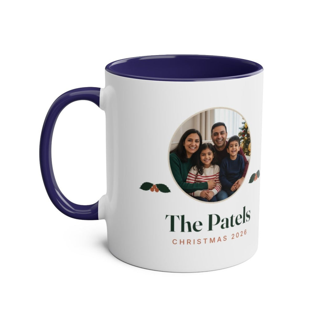 Christmas photo two-tone mug mock-up in the dark blue colour, handle on the left, with the family photo and 'The Patels'