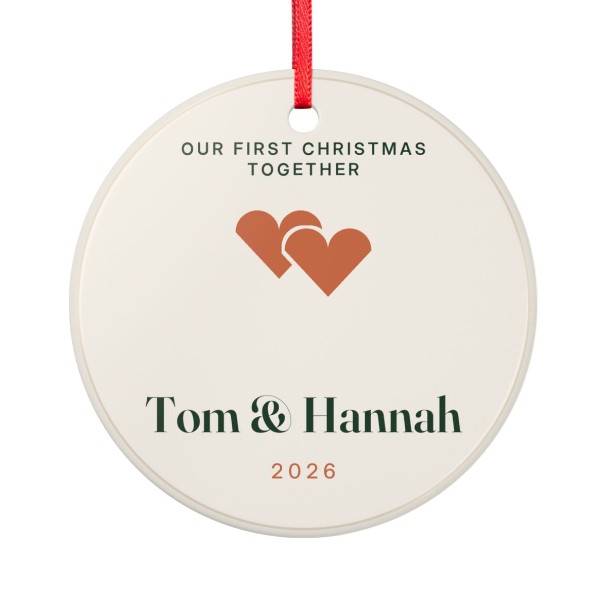 Our first Christmas together ornament mock-up seen from the other side, with the same two hearts, 'Tom & Hannah' and '2026'