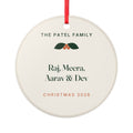 Family ceramic Christmas ornament mock-up with a red ribbon, holly, 'The Patel Family' and four sample names