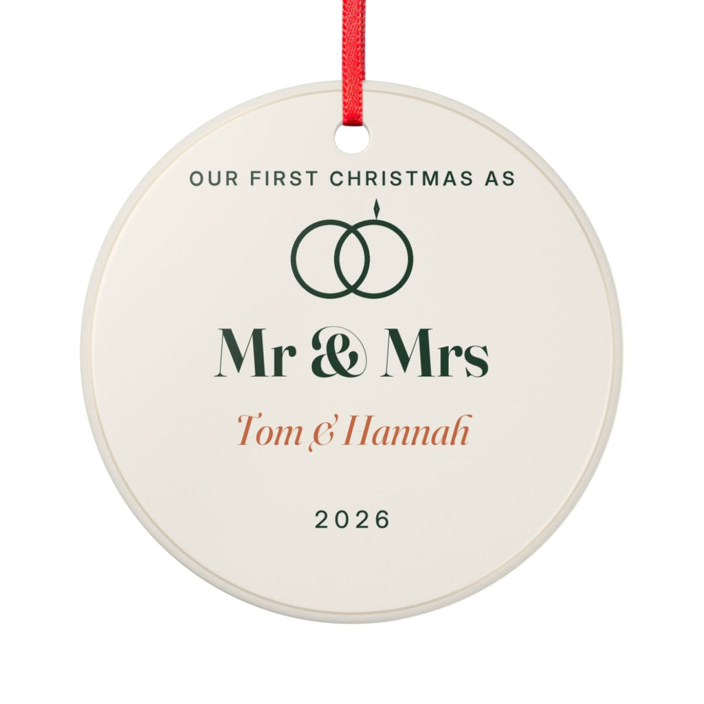 Personalised our first Christmas ornament mock-up, round cream ceramic with linked rings, 'Mr & Mrs' and 'Tom & Hannah'