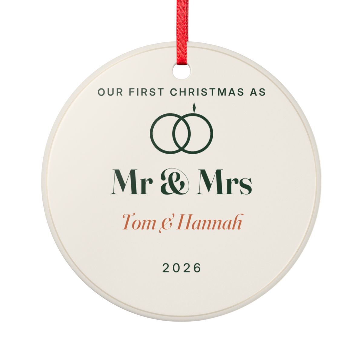 Personalised our first Christmas ornament mock-up, round cream ceramic with linked rings, 'Mr & Mrs' and 'Tom & Hannah'
