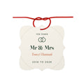 10th anniversary aluminium ornament mock-up with a red ribbon bow, 'Ten years', two rings, 'Mr & Mrs' and 'Tom & Hannah'