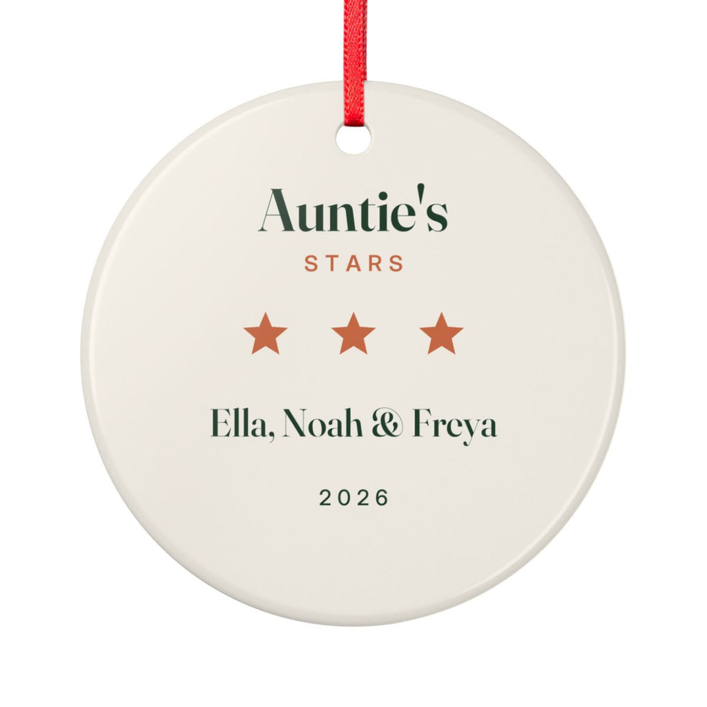 Personalised Auntie's Stars ceramic ornament mock-up, round with a red ribbon, three stars, 'Ella, Noah & Freya' and '2026'
