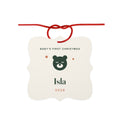 Personalised Baby's First Christmas aluminium ornament mock-up, cream scalloped square with a green bear, 'Isla' and '2026'