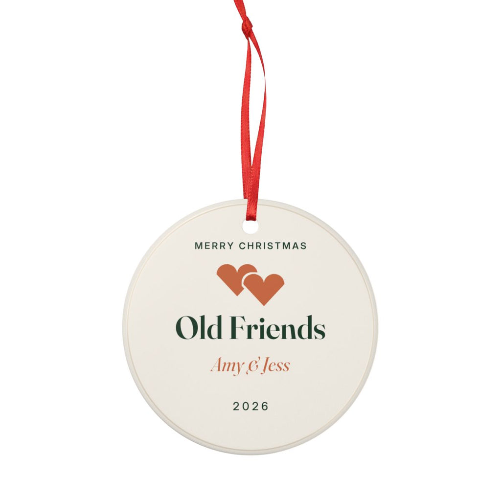 Friends Christmas ornament mock-up, round on a red ribbon, printed 'Merry Christmas', 'Old Friends', 'Amy & Jess' and '2026'