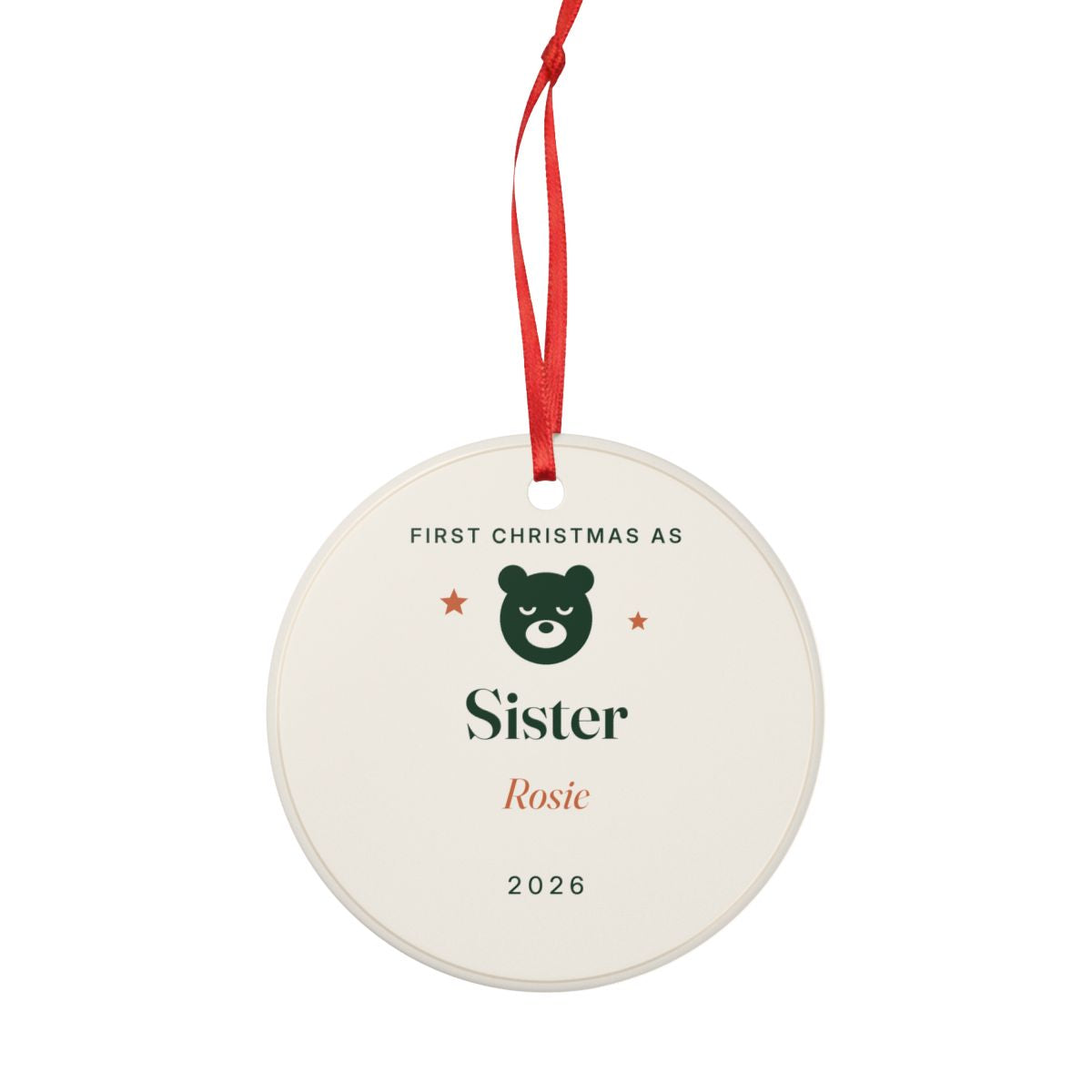 First Christmas as Sister ornament hanging from its red ribbon, seen from the other side with the same design