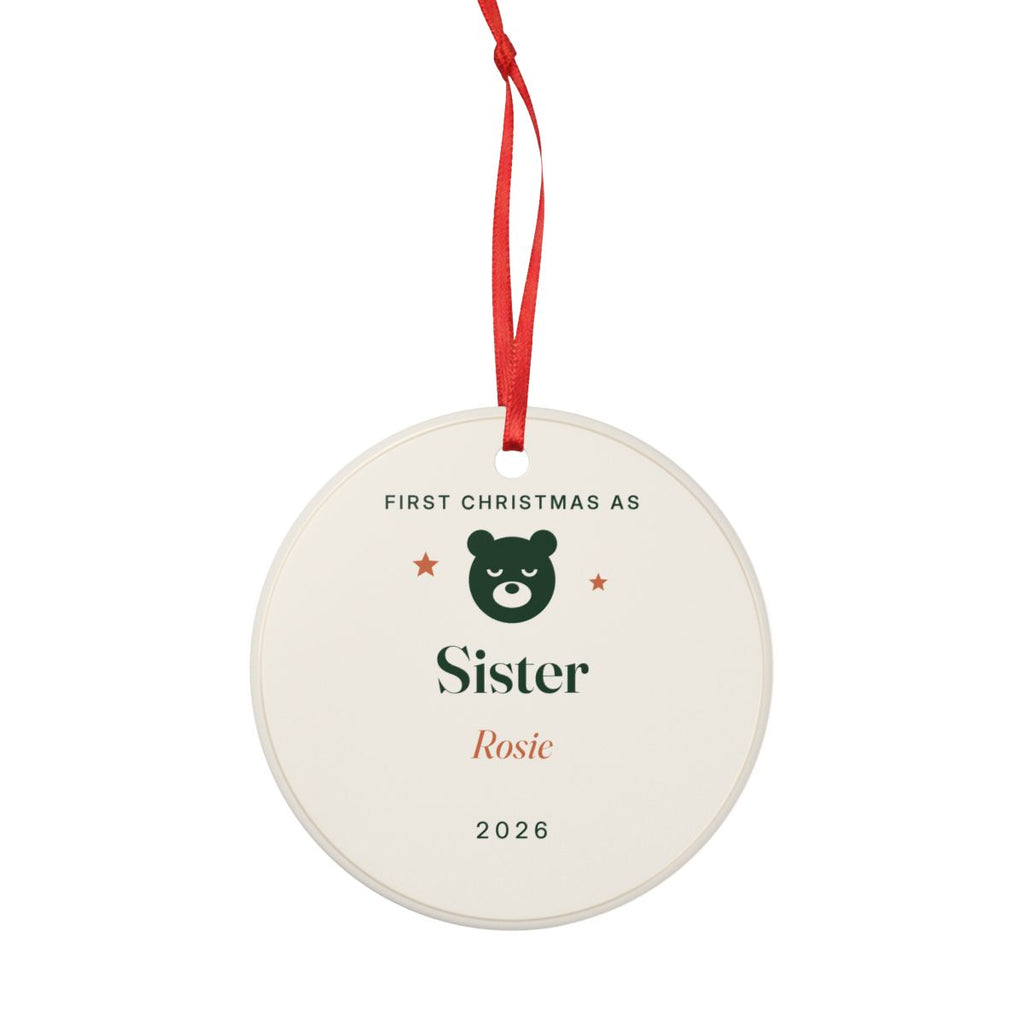 First Christmas as Sister ornament hanging from its red ribbon, with the green bear, 'Sister', 'Rosie' and '2026'