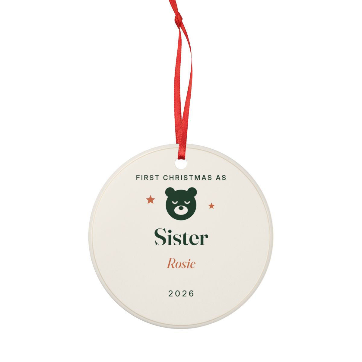 First Christmas as Sister ornament hanging from its red ribbon, with the green bear, 'Sister', 'Rosie' and '2026'