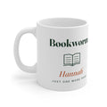 Personalised Bookworm mug mock-up, handle on the left, with an open book icon, 'Hannah' and 'Just one more page'
