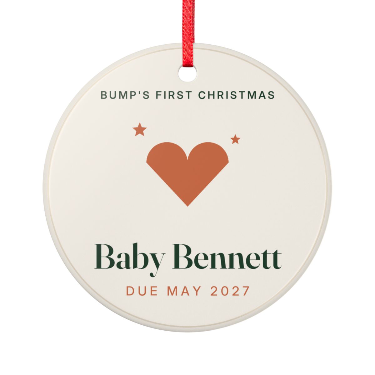 Personalised Bump's First Christmas ornament mock-up, round cream disc with an orange heart, 'Baby Bennett', 'Due May 2027'