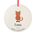 Personalised cat Christmas ornament mock-up, round cream disc with an orange cat on holly, 'Luna' and 'Merry Christmas'