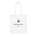 Personalised Christmas Eve white cotton tote bag mock-up laid flat, with a reindeer face, 'Christmas Eve' and 'Rosie'