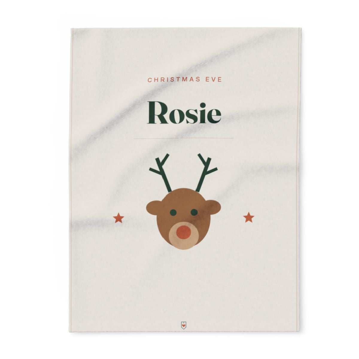 Personalised Christmas Eve fleece blanket mock-up laid flat, 'Rosie' in large letters and a reindeer face between two stars